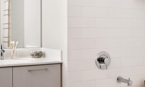 a bathroom with a tub and sink