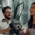 a couple laughs on couch with their dog