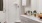 a bathroom with a shower unit and toilet